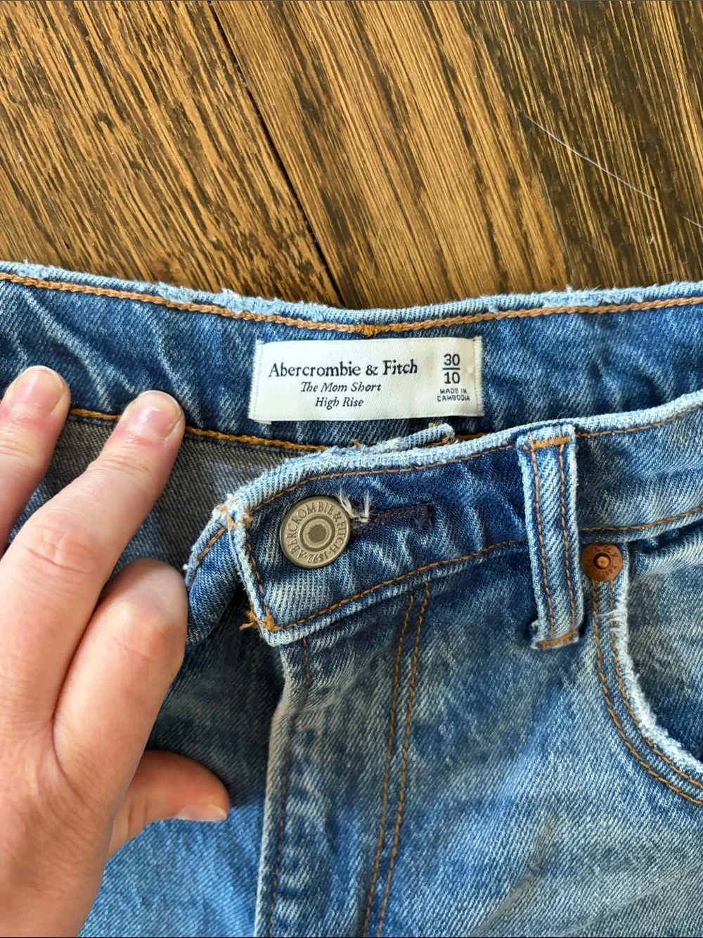 Distressed Light Blue Denim Shorts - Women's